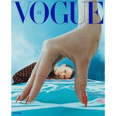 a magazine cover with a woman's hand reaching for the camera