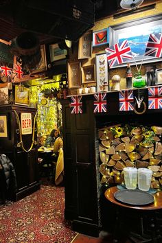 the interior of a bar decorated with british flags