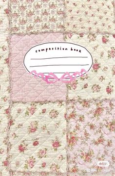 a pink and white patchwork quilt with the words composition bag on it's side