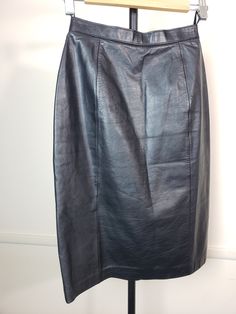 Discover Timeless Elegance: Elevate your wardrobe with this exquisite Vintage Wilson's Leather Black Skirt, a testament to classic sophistication and enduring style. Crafted with the modern woman in mind, this skirt blends the allure of vintage with the functionality of contemporary design. Key Features: Premium Quality: Made from the finest leather and lined with soft polyester, this skirt offers both luxury and comfort. Its flawless condition and minimal signs of wear and tear reflect its exceptional quality and craftsmanship. Perfect Fit: Tailored to fit a Women's Size 8, with a waist measurement of 25 inches and approximately 38 inches at the hips, this skirt is designed to flatter your figure while ensuring a comfortable fit. Elegant Details: The skirt measures 24 inches from the wais Diy Fashion Accessories, Womens Skirts, Leather Midi Skirt, Black Leather Skirts, Leather Pencil Skirt, Vintage Rock, Leather Shirt, Midi Skirt Pencil, Rock Design