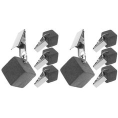 six pairs of black and white hexagonal cufflinks with metal posts on each end