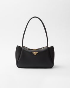 Leather handles Metal hardware Enameled metal triangle logo on the front Zipper closure Fabric logo-print lining with three compartments Prada Aimee Bag, Black Prada Bag, Pretty Coffee, Triangle Logo, Black Leather Handbags, Black Handbags, Prada Bag, Beautiful Bags, Leather Handle