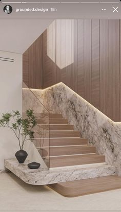 the stairs are made of marble and wood