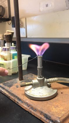 a person is working on something with a lighter