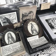 some framed pictures and other items on display