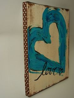 a wooden sign with the word love painted on it