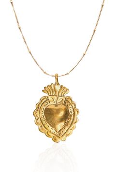 "The sacred heart is a religious symbol comprised of a flaming heart shining with divine light. The fire represents the transformative power of love.  Our heart is beautifully handcrafted hanging on a satellite chain.  DETAIL & SIZE Vermeil heart pendant 2\" high with 18K gold filled satellite chain.  Available in 16\" or 18\" This necklace is also available in sterling silver see other listing." Sacred Heart Pendant, Spiritual Brass Heart Pendant Necklace, Spiritual Necklace With Heart Charm, Spiritual Heart Charm Necklace, Spiritual Medallion Necklace For Valentine's Day, Spiritual Medallion Necklace With Heart Charm, Spiritual Heart-shaped Brass Necklaces, Spiritual Heart-shaped Brass Necklace, Sacred Heart Necklace