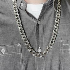 Men's silver-tone Cuban hip hop chain. Every other link is iced with round stones. Stones shine so hard they will blind you. Measures 30" long x 14mm thick. Solid piece weighs in at 150 grams. Stylish and secure box clasp closure. FREE SHIPPING in USA. Order now! Silver Cuban Link Chain Necklace Iced Out, Silver Cuban Link Jewelry For Streetwear, Silver Iced Out Cuban Link Necklace, Iced Out Silver Cuban Link Necklace, Silver Link Jewelry For Streetwear, Silver Curb Chain Jewelry For Streetwear, Silver Cuban Link Necklace With Bling, Silver Chain Link Jewelry For Streetwear, Iced Out Chain Link Jewelry For Streetwear