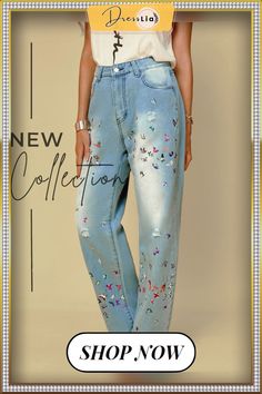 a woman wearing blue jeans with flowers painted on them and the words new collection shop now