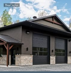 a large building with two garage doors on each side and a covered entrance to the front