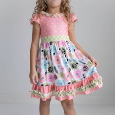 Peach, green, pink, blue floral print, polka dot, and gingham check print dress. Cap sleeve with keyhole back detail. Lots of ruffles for twirling! From premium brand Oopsie Daisy. Cute puff sleeves and full skirt make for perfect Easter spring photos! 95% Polyester, 5% spandex for all the comfort and just the right amount of stretch. Available in sizes 3y-12y. This dress Made in the USA and ships from our US warehouse, arriving to you within about 3-5 business days. Playful Spring Ruffle Dress With Ruffle Hem, Playful Dresses With Ruffle Hem For Spring, Playful Ruffle Dress For Spring, Playful Floral Print Twirl Dress For Spring, Pink Ruffle Twirl Dress For Spring, Pink Ruffled Twirl Dress For Spring, Playful Ruffled Short Sleeve Dress, Cute Spring Twirl Dress With Ruffles, Playful Short Sleeve Dress With Ruffles