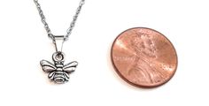 Show off your love for Bees in the adorable silver color Bumble Bee necklace. Great for everyday wear, this Bee Charm Necklace will become your new favorite. Even with its dainty size, you can see the details of the Bee, including its wings and stripes. GREAT GIFT: The Bee charm pendant necklace is displayed on a colored card that shows a few tips or advice from a Bee's perspective. It makes a great gift as the recipient will surely relate to and get a kick out of the advice coming from her favo Casual Nickel Free Necklace For Gift, Casual Nickel-free Necklace For Gift, Casual Silver Jewelry For Everyday Use, Nickel Free Casual Jewelry Gift, Nickel-free Casual Jewelry For Gifts, Casual Silver Jewelry As Gift, Casual Silver Jewelry For Gifts, Casual Stainless Steel Necklaces As Gift, Casual Stainless Steel Necklaces For Gifts