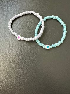 elastic bracelet for girls made with colored bead Casual Turquoise Stretch Bracelet With Letter Beads, Casual Adjustable Stretch Bracelet With Heart Beads, Trendy Turquoise Stretch Bracelet With Letter Beads, Casual Heart Beads Stretch Bracelet For Gift, Casual Heart-shaped Beaded Bracelets With Letter Beads, Casual Beaded Bracelets With Heart Beads For Friendship, Cute Blue Stretch Bracelet With Colorful Beads, Friendship Stretch Bracelet With Heart Beads, Friendship Heart Beads Stretch Bracelet