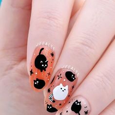 Stephanie - Nail Artist & Luxe Nail Polish Maker on Instagram: "Halloween blob kitties!  This design is from fabric from Ikea! It’s called “LÄKEMALVA,” if you want to order some for your spooky, Fall creations!!  ..  Orange jellies (from top to bottom, first photo): “Tangerine Jelly” “Clay” coming soon!! “Slip” “Radiator Springs” + “Excelsior” All from JL Lacquer  . . .  #freehandnailart #nailart #handpaintednailart hand painted Halloween kitty cat with stars fall spooky season nail art design #catnails" Cat Gel Nails Art Designs, Cat And Ghost Nails, Cat Nail Designs Cute, Cat Ghost Nails, Dog Halloween Nails, Cute Ghost Nail Art, Cat Christmas Nails, Cat Eye Ghost Nails