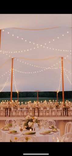 A sailcloth tented wedding reception lit by candlelight Sailcloth Tent Lighting, Sailcloth Tent Wedding Lighting, Sailcloth Tent Wedding, Wedding At Night, Wedding Tent Lighting, Tented Wedding Reception, Sail Cloth