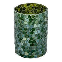 a green mosaic vase sitting on top of a table