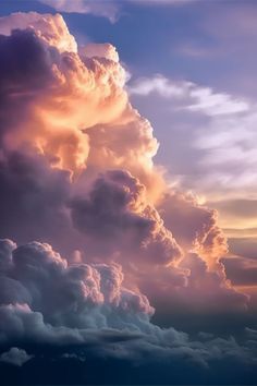 an airplane flying in the sky with clouds