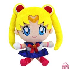 a stuffed animal doll with blue eyes and blonde hair, dressed in a sailor outfit