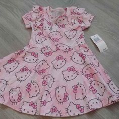 Girls Hello Kitty Dress Size 2t Spring Hello Kitty Print Cute Dress, Cute Short Sleeve Dresses With Hello Kitty Print, Cute Hello Kitty Print Spring Dress, Spring Cute Hello Kitty Print Dress, Hello Kitty Print Cute Spring Dress, Playful Cotton Dress With Hello Kitty Print, Cute Pink Hello Kitty Print Dress, Cute Pink Hello Kitty Dress, Fitted Pink Hello Kitty Dress