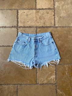 "Vintage 90s Light Wash Distressed Shorts by GAP 29/30W, tagged a W30. Made in USA. 100% cotton. Button fly. It has distressing and has light marks on the back side, shown in the last two slides. Shown held on a XS, 5'3\". Measurements: Waist: 14.5\" Waist (taut): 15\" Rise: 11\" Hips: 19.5\"" Cheap Vintage Dark Wash Shorts, Light Wash Distressed Cotton Bottoms, Distressed Light Wash Cotton Bottoms, Ripped Light Wash Cotton Shorts, Faded Cotton Ripped Jean Shorts, Faded Ripped Cotton Jean Shorts, Ripped Cotton Shorts With Short Leg, Ripped Cotton Shorts With Short Legs, Light Wash Ripped Cotton Shorts