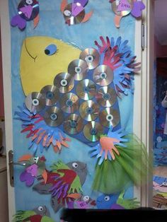 a door decorated with cds and fish