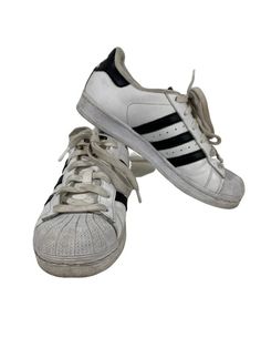 You are purchasing the one and only Adidas Shell-Toed Superstar White with Black Stripes Size US Youth 4.5 Pre-Owned. These shoes are in a classic Superstar Shell Toed style white with 3 Black Stripes low cut and are size US  Youth 4.5. This pair of Adidas are in good condition with normal wear and tear.  These adidas will add style to any outfit. This style normally retails $70 or more.  Shipping with USPS Priority Mail or FedX Smart Post. Free Returns.  All Orders Prior to Noon Mountain Time W Adidas White Shoes, White Tip, Adidas Superstar Sneaker, White Adidas, Black Adidas, Adidas Shoes, Black Stripes, Adidas Sneakers, Shells