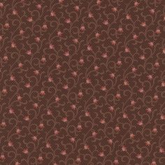 a brown background with red flowers and swirls