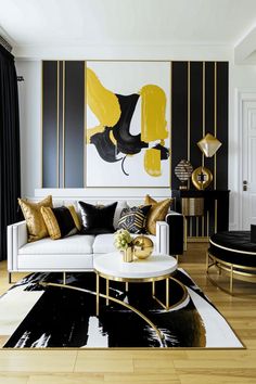 a black and white living room with gold accents on the walls, couches and rugs