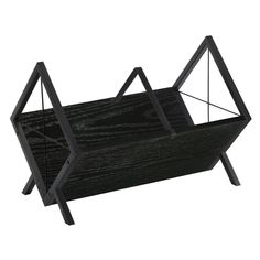 a black wooden shelf with metal legs and an upside down design on the bottom, against a white background