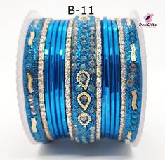 Project Description Gorgeous Bangle set suitable for sarees and ethnic outfit. Stones into a shining form of jewelry is what we need to make our day. Lightweight, durable, & flawless finish with intricately crafted from metallic alloy. Actual color & quality of the image may slightly vary due to the lighting effects & screen resolution Dimension: 2.4", Refer to the size chart Select the style/design indicated on the bangle. Design: BGL#449 Blue Traditional Bangle For Festive Occasions, Blue Bangle For Weddings And Festivals, Traditional Blue Bracelets For Festivals, Traditional Blue Bangle For Weddings, Blue Wedding Bangle For Festive Occasions, Festive Blue Round Bangle, Traditional Blue Wedding Bangle, Blue Festive Wedding Bangle, Festive Blue Wedding Bangle