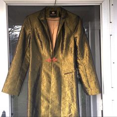 Rococo Olive Green Full Length Duster Jacket. Beautiful Sheen Finish. Center Loop Closure. Polyester Lined. Shoulder Pads. Excellent Condition. Approximate Measurements : Chest 17 In Sleeve 24 In Length 53 In Measurement At Clasp: 15 In Duster Jacket, Rococo, 18th Century, Shoulder Pads, Olive Green, Full Length, Coats Jackets, Jackets & Coats, Jackets For Women