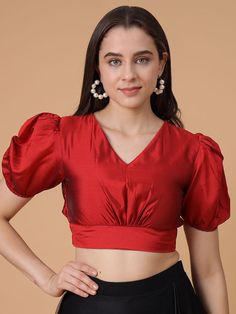 *This stunning deep red satin blouse combines elegance with modern flair * Perfect for any occasion *The puffed short sleeves and flattering V-neckline add a touch of sophistication * While the fitted waist and pleated details create a chic, tailored look *Made from luxurious Satin Silk   * This blouse is designed for comfort and style, making it an ideal choice for festive events, weddings, or parties * Pair it with sarees, skirts, or lehengas for a timeless, versatile look that stands out. Party V-neck Top With Gathered Sleeves, Elegant Red V-neck Blouse Piece, Red Satin Party Blouse, Elegant Short Sleeve Blouse With Gathered Sleeves, Elegant Red Satin Blouse, Puffed Blouse Designs, Fitted Satin Blouse With Puff Sleeves, Formal Satin Blouse With Short Sleeves, Fitted Satin Puff Sleeve Blouse