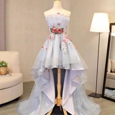 Fitted High Low Prom Dress, Floral Applique Prom Dress For Prom Season, Floral Applique Gown For Prom Season, Floral Applique Dresses For Debutante Ball And Prom Season, Spring Strapless Tulle Dress For Prom, Luxury Floral Applique Prom Dress, Luxury Floral Applique Prom Evening Dress, Floral Applique Gown For Prom Season Banquet, Floral Applique Gown For Banquet During Prom Season