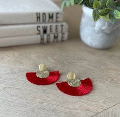 Metallic red gold tassel earrings. Width 2.2 inch and height 2 inch. Perfect to wear year round. The earrings are giving the summer and beachy vibe. Island style boho bohemian ethnic native. Suitable to wear year round and daily wear Red Fringe Tassel Earrings For Summer, Red Bohemian Jewelry For Vacation, Bohemian Red Jewelry For Vacation, Beach Gold Tassel Earrings, Red Tassel Earrings For Summer, Gold Tassel Earrings For Beach, Beach Gold Fringe Earrings, Red Bohemian Tassel Earrings For Summer, Gold Fringe Earrings For Beach