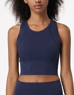 The EMES SHOP sports bra is detailed with a high round scoop neckline. thick tank straps. a built-in lined bra. and cropped fit. Features a thick waistband and acontouring seaming. This light-weight. quick-drying. buttery soft compressing sportsbra features all the support and comfort you need. while still looking cute.MATERIAL:75% Nylon. 25% Spandex MEASUREMENTS:Small : 4-6 Waist: 25-26.5 in Chest: 33-34.5 inMedium : 6-8 Waist: 26.5-28 in Chest: 34.5-36 inLarge : 8-10 Waist: 28-29.5 in Chest: 3 Cropped Gym Crop Top With Built-in Bra, Sporty Racerback Crop Top With Built-in Bra, Functional Sleeveless Crop Top With Built-in Bra, Stretch Tank Sports Bra With Built-in Padding, Stretch Sports Bra With Built-in Padding And Tank Straps, Compressive Crop Top With Built-in Padding For Workout, Sleeveless Sports Bra With Built-in Padding For Yoga, Medium Support Sports Bra With Built-in Bra, Solid Cropped Activewear With Built-in Bra