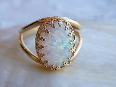 "Opal Gold Ring, Gemstone ring, White Opal Ring, October Birthstone, Opal White Gold Filled Ring, White Opal jewelry, Opal Feminine Ring It will be a perfect gift for women. It is made of gold filled 14k and Opal or 925 silver Measurements: Size- available all size The center stone is 10mmx14mm Please select in the \"type box\". The ring will be packed in a gift box. FOR MY RINGS COLLECTION HERE: https://www.etsy.com/il-en/shop/rebekajewelry?section_id=14282915&ref=shopsection_leftnav_9 TO G Opal Gold Ring, Gold Knot Ring, White Opal Ring, Jewelry Opal, Opal Ring Gold, Fire Opal Ring, Gold Diamond Wedding Band, Engagement Ring White Gold, Opal White