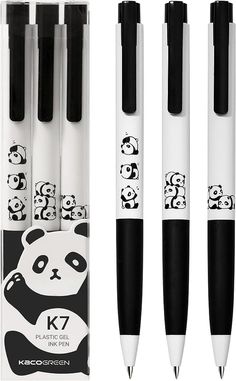 four black and white pens with panda faces on them