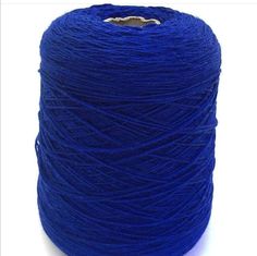 a spool of blue yarn on a white background