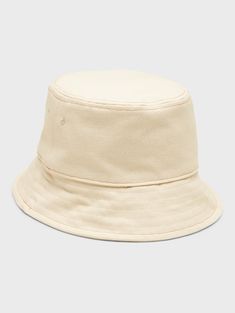 A classic bucket hat made in soft, washed canvas.  Circumference: S/M 24" (61cm), L/XL 25" (63. 5cm) Brim width: 2. 375" (6cm) Casual Brimmed Canvas Bucket Hat, Casual Solid Bucket Hat For Spring, Basic Solid Color Hats For Spring, Basic Solid Summer Hats, Classic 5-panel Spring Hat, Classic Solid Bucket Hat With Short Brim, Classic Solid Color Bucket Hat With Short Brim, Beige Cotton Bucket Hat For Outdoor, Adjustable Cream Cotton Bucket Hat