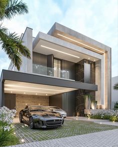 two cars parked in front of a modern house