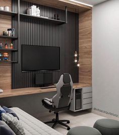 a room with a couch, chair and television on the wall in front of it