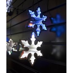 an illuminated snowflake hanging from the ceiling