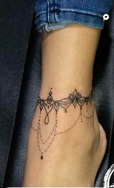 a woman's foot with a tattoo on it