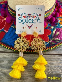 These Beautiful Mexican Earrings are made with the Mexican art form of twisting gold plated wires to create beautifully intricate works of art. The silk thread tassel adds that beautiful pop of color to any outfit. These earrings are handmade by Mexican Artisans. More colors available here: https://www.etsy.com/es/listing/974160414/aretes-mexicanos-de-filigrana-aretes?ref=listing_published_alert Gold Earrings With Latkans For Summer, Gold Chandelier Earrings For Summer Gift, Gold Dangle Tassel Earrings For Summer, Gold Tassel Jewelry For Summer, Gold Tassel Drop Earrings For Summer, Adjustable Gold Tassel Earrings For Party, Yellow Tassel Earrings As Gift, Summer Gold Tassel Jewelry, Summer Gold Tassel Earrings