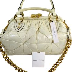 Brand: Marc Jacobs Model: Lather Shoulder Body Ivory & Gold Measurements: 11"X15"X6" Condition: Pre Owned Sold As Is Soft Description: Marc Jacobs Handbags Are Coveted For Their Distinctive Designs, Premium Craftsmanship, And Timeless Appeal. The Brand Offers A Wide Range Of Handbag Styles, Each Reflecting Marc Jacobs' Signature Blend Of Sophistication, Playfulness, And Modernity. High-end White Satchel With Gold-tone Hardware, Designer Cream Shoulder Bag With Detachable Strap, Designer White Satchel With Gold-tone Hardware, Designer Cream Satchel, Designer White Satchel With Top Carry Handle, Designer Cream Satchel With Handles, Designer Cream Shoulder Bag For Formal Occasions, Designer Cream Shoulder Bag With Top Handle, Designer Cream Top Handle Shoulder Bag