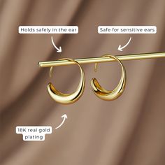 These earrings were designed to add a unique twist to the must-have gold hoop trend. Classic, timeless, and guaranteed to elevate any look. 18K gold-plated, brass Size: 1in x 0.8in Holds safely in the ear Lightweight Hypoallergenic, lead & nickel free If you aren't in LOVE with your purchase, please let us know within 30 days of receiving your item, and you'll receive a stress-free refund. Drop Hoop Earrings, Bubble Bag, Free Earrings, Black Gift Boxes, Stunning Earrings, Gold Hoop, Silver Hoop Earrings, High Quality Jewelry, Free Jewelry