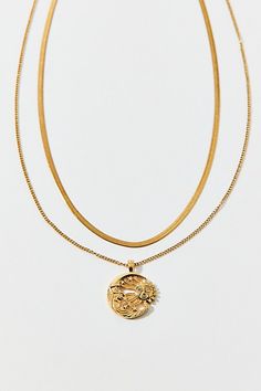 This necklace set includes two coordinating chains complete with a celestial pendant. Wear them layered together or on their own to mix up your look. Features Stainless steel sun and moon charm layering necklace set Gold or silver stainless steel necklace set Includes two coordinating necklaces Sleek snake chain paired with a celestial charm necklace Lobster closure Durable stainless steel Tarnish, water and sweat resistant Hypoallergenic Content + Care Set of 2 necklaces Stainless steel Avoid c Celestial Pendant, Gold Necklace Set, Moon Charm, Layering Necklace, Steel Necklace, Stainless Steel Necklace, Snake Chain, Layered Necklaces