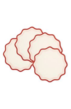 three red and white plates sitting on top of each other in front of a white background