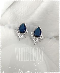 "Something Blue for your special day Art Deco - The Great Gatsby & Downton Abbey inspired sapphire royal blue crystal pear drop / leaf and pearl stud earrings : \"SCARLETT\" by ©White Peony by KC. Beautiful and sparkling crystal earrings are made of AAA quality large sapphire royal blue and clear Cubic Zirconia (zircon, CZ) / white gold plated components and hand embellished with small 3mm Swarovski crystal pearl (photo shown in \"white\"). If you don't need peal, you can choose \"no pearl\" Sapphire Jewelry With Sparkling Stones For Wedding, Blue Wedding Jewelry With Matching Earrings, Elegant Blue Hand-set Bridal Earrings, Elegant Hand Set Blue Bridal Earrings, Sapphire Jewelry With Matching Earrings For Wedding, Elegant Blue Crystal Earrings For Wedding, Elegant Blue Crystal Wedding Earrings, Silver Sapphire Earrings For Wedding, Teardrop Sapphire Wedding Jewelry