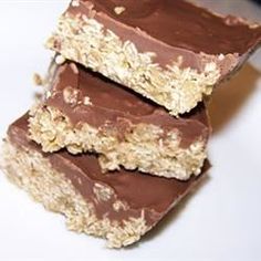 three pieces of chocolate and oatmeal bars stacked on top of each other